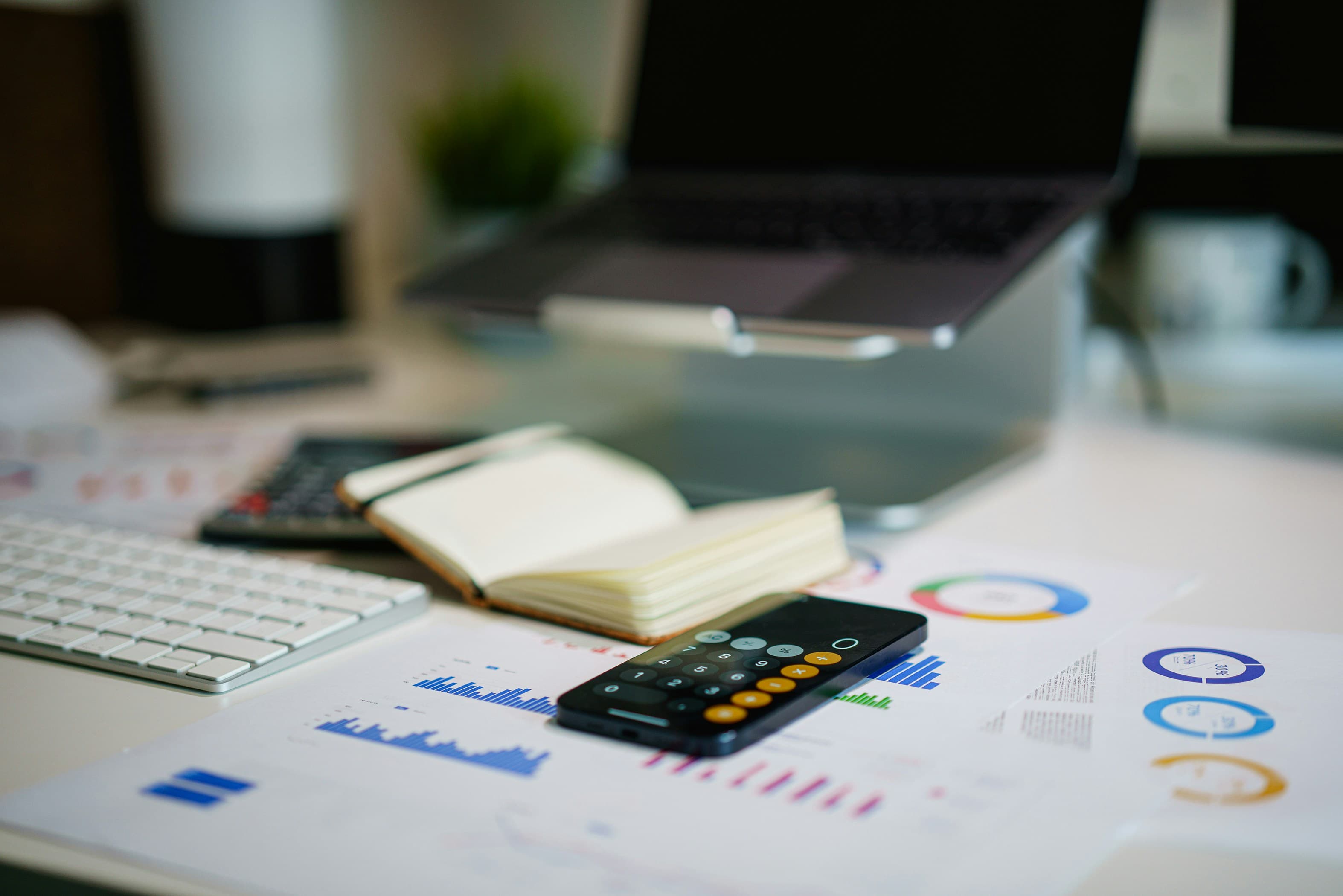 Financial documents and calculator on a desk